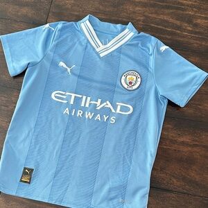 Kids Manchester City jersey, size Small (US)
